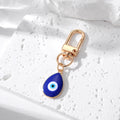 Gold and Silver Tone Blue Evil Eye Clip Keychains in Eleven Styles view 3