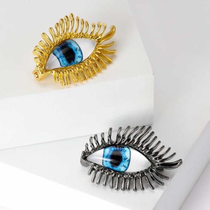 Blue Eye Crystal Eyelash Brooch in Gold or Black Finish