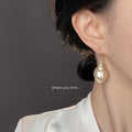 Gold Fishhook Iridescent Cream Conch Shell Drop Earrings view 2