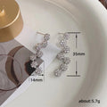 Silver Tone Floral Drop Earrings with Clear Stones view 5