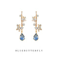 Gold Tone Clear Stone Floral Branch And Blue Teardrop Stud Earrings view 1