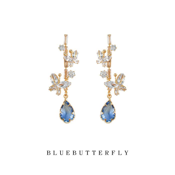 Gold Tone Clear Stone Floral Branch And Blue Teardrop Stud Earrings