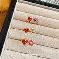 Gold Open Rings With Red Strawberry And Enamel Flower Ends view 4