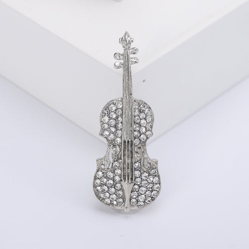Front product view of the crystal violin brooch on a light background