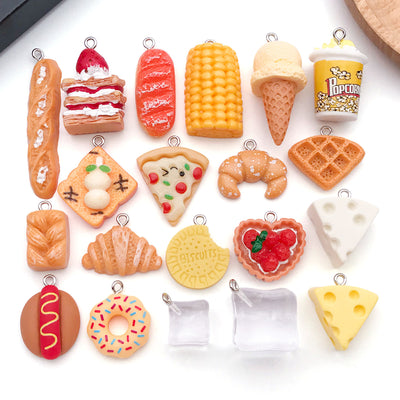 Multicolor cake charms arranged on a light background