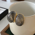Gold Tone Oval Textured Stud Earrings in Three Colors view 2