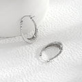 Hammered Silver Tone Sculpted Oval Medium Hoop Earrings view 4