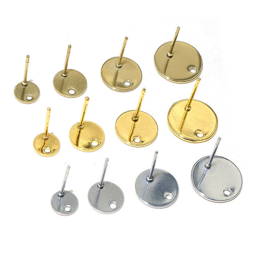 round post earring pad findings arranged together on a white background