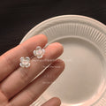Iridescent Four-Petal Flower Stud Earrings Pink Centers view 3