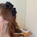 Black Satin Bow Hair Claw With Layered Loops And Knotted Center view 2