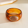 Acrylic Wide Bangle with Oval Gold-Framed Cabochon view 7