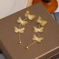 Triple Butterfly Extra Long Stud Earrings in Gold and Silver view 6