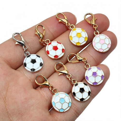 Enamel soccer ball charm fitted with a lobster clasp in a close view showing the front and back