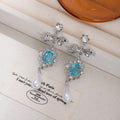 Blue Oval White Pearl Look Silver Floral Dangle Earrings view 4