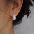 Silver Crisscross Clear Stone Huggie Earrings Metal Jewelry Design view 3