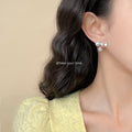 Silver Tone White Pearl And Clear Stone Starburst Stud Earrings view 2