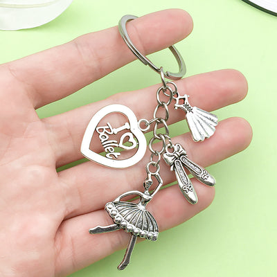 Image 1 showing a hand holding a keychain with various charms.