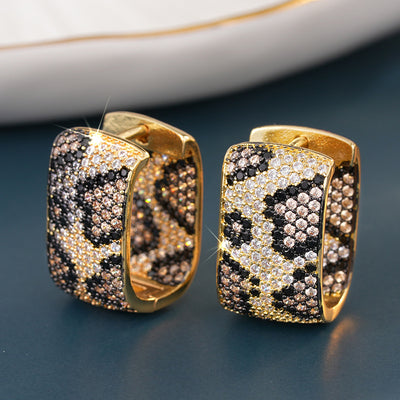 Additional product view showing wide leopard-pattern hinged hoop earrings
