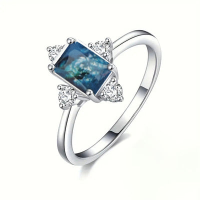 Silver rectangle blue ink clear side stone ring alternate studio shot