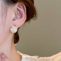 White Floral Cluster Stud Earrings With Gold Accents view 4