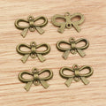 Open Bow Charms in Black, Gold, Silver, and Bronze Tones view 3