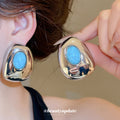 Blue Oval Resin Stud Earrings in Gold and Silver Tones view 4