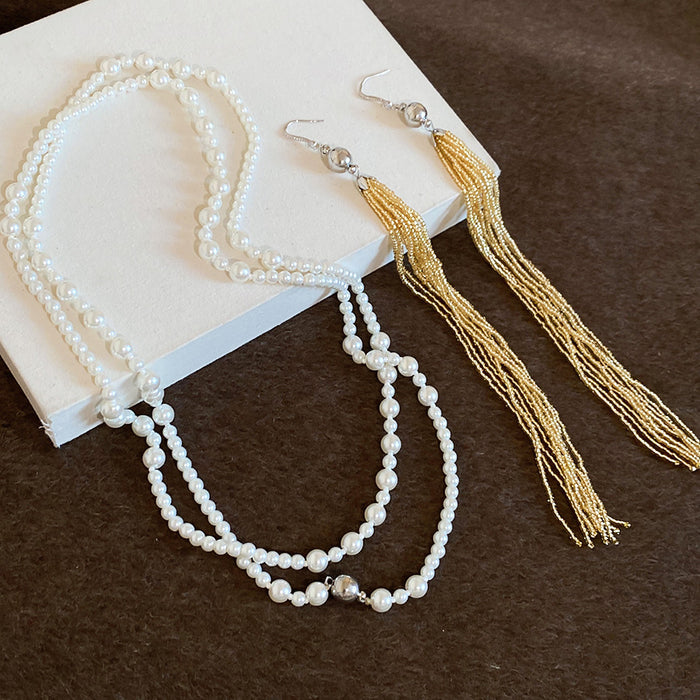 Pearl Strand Magnetic Tassel Necklace with Polished Metal Tone Details