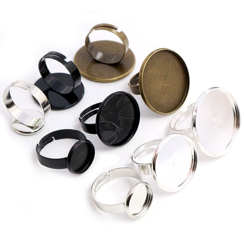 Assorted round cabochon ring blank settings in mixed finishes arranged together in the main product view