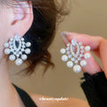 Silver Tone Crystal and Pearl Look Chandelier Earrings view 1