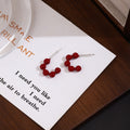 Red Beaded Curved Crescent Bold Statement Stud Earrings view 1