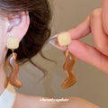 Wavy Resin Drop Earrings in Blue Green Red and Amber view 4