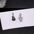 Mismatched Guitar and Treble Clef Silver Tone Stud Earrings view 1