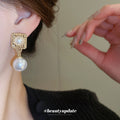 Gold Tone Square Pearl Drop Stud Earrings With Decorative Metal Accents view 3