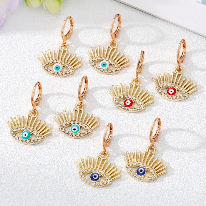 Gold and Silver Tone Crystal Lash Evil Eye Huggie Earrings
