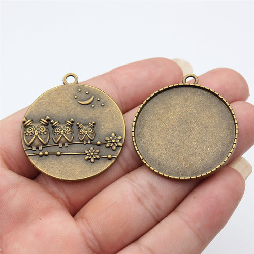 Round Crown Back Pendant Setting 35mm in Two Finishes shown in hand