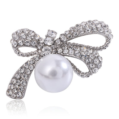 Crystal Ribbon Bow Brooch With Large White Pearl Drop shown from the front on a white background