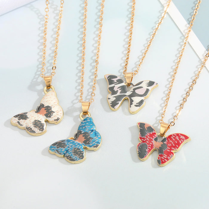Gold Tone Patterned Butterfly Pendant Necklaces in Four Designs