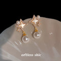 Gold Tone Clear Stone Open Star And White Pearl Drop Stud Earrings view 4