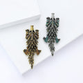 Textured Pangolin Brooch in Metal with Layered Scale Texture in an Elongated Animal Shape view 2