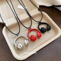 Mini Headphone Pendant Necklace on Adjustable Black Cord view 2