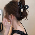 Gunmetal Tone Sculptural Loop Hair Claw With Large Round Bead Detail view 4