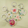 Silver Tone Round Pressed Flower Resin Clip Keychains in Five Designs view 2