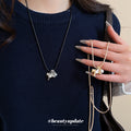 Horse And Pearl Pendant Necklace In Beige And Black view 1