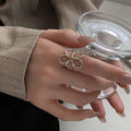 Silver Tone Open Wire Flower Ring With Textured Gold Tone Center view 1