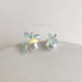 Silver Tone Pale Blue Bow And Large Pearl Like Stud Earrings view 1