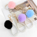 Faux Fur Pom-Pom Keychain with Faux Pearl Wristlet Strap view 1