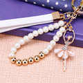 Pearl Wrist Loop Keychains with Angel Daisy Swan and Bear Charms view 1