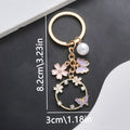 Pink Purple Openwork Butterfly Flower and Pearl Charm Keychain view 4