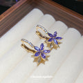 Purple Crystal Flower Huggie Earrings With Decorative Metal Details view 3