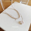 Layered White Pearl Necklace with Round Floral Pendant view 4